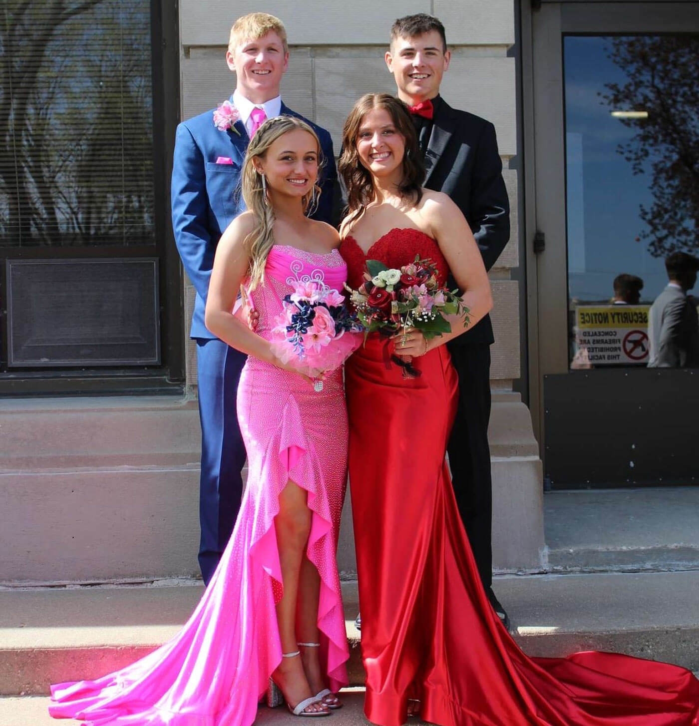Photo of the models wearing a gowns and tuxedos