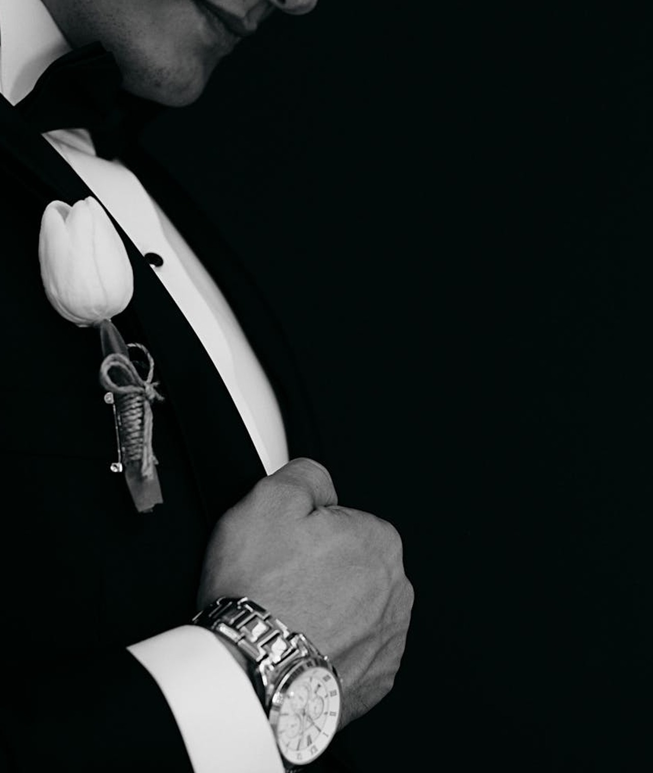 Photo of the model wearing a tuxedo in black and white