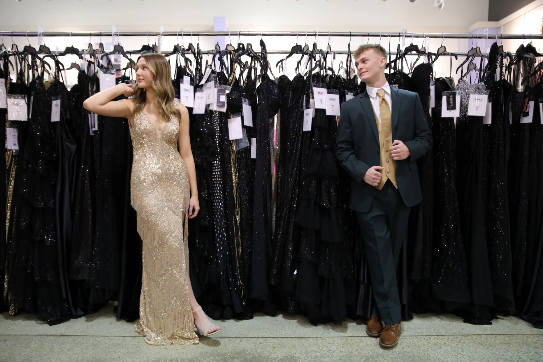 Photo of the models wearing formal gowns